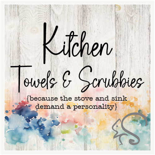 Kitchen Towels & Scrubbies collection graphic on a weathered wood background with watercolor splashes