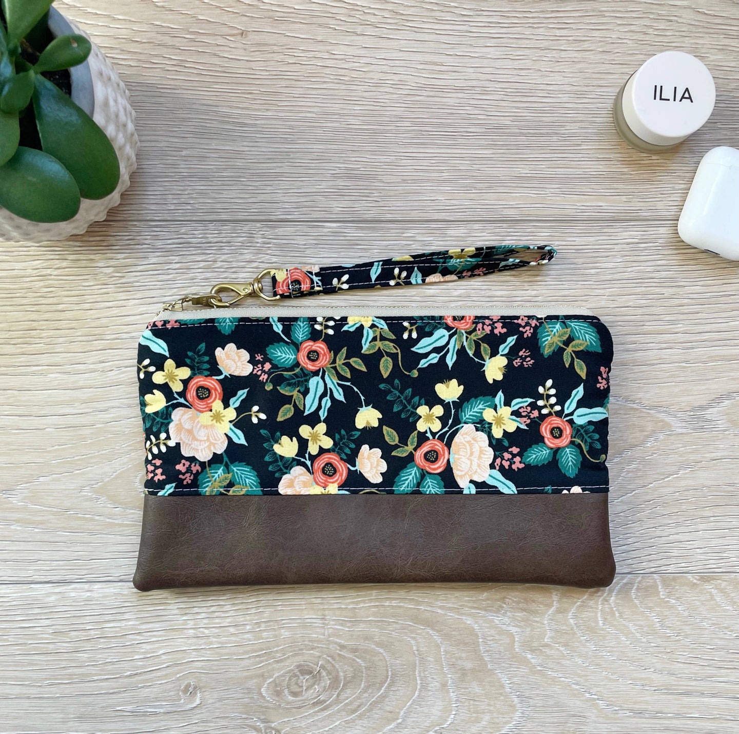 Black and orange floral Wristlet